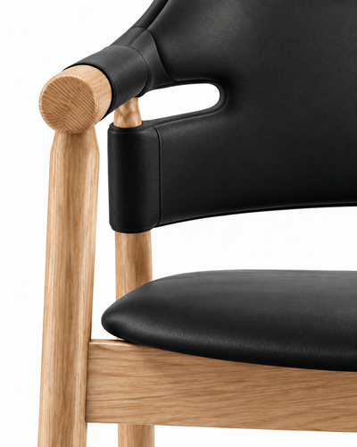 FRAME DINING CHAIR WITH ARMRESTS material close-up — black leather